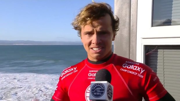 An emotional Julian Wilson speaks about how he tried to get to Mick Fanning as the shark lunged.