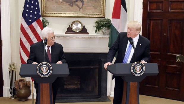 US President Donald Trump (right) speaks while Mahmoud Abbas, president of Palestine during a joint press conference in the Roosevelt Room of the White House.