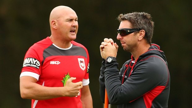 Paul McGregor and Steve Price watch a Dragons training session.