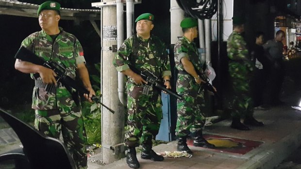 Indonesian army officers stand guard outside Bali's Kerobokan jail after the deadly fight.