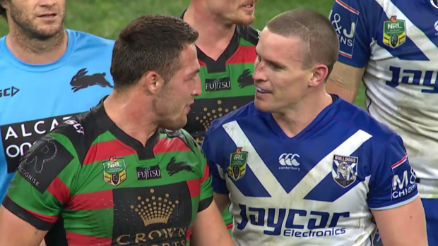 Up close and personal: Sam Burgess and Tim Browne rekindle an old feud on Friday night.