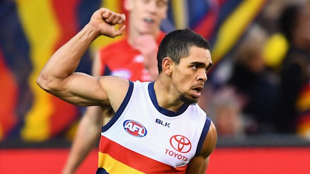 Charlie Cameron celebrates one of his two goals against the Demons at the MCG.