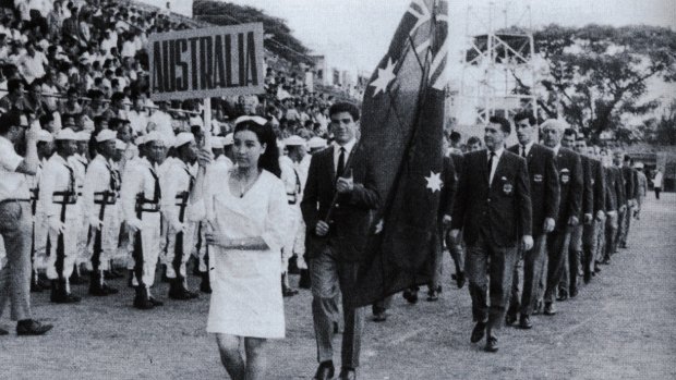 Johnny Warren carries the flag at the opening ceremony of the Friendship Tournament in Saigon, 1967.
