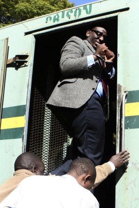 Edmund Kudzayi, editor of the state-run Sunday Mail newspaper, leaves Harare Magistrates Court on Saturday.