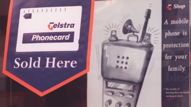 That was then: A Telstra shop ad promoting phonecards and a primitive mobile phone.