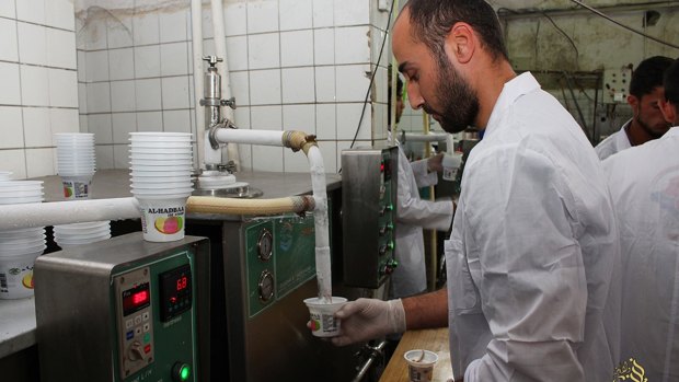 A television channel run by Islamic State  shows ice cream being manufactured in the Iraqi city of Mosul, now held by IS for more than a year. 