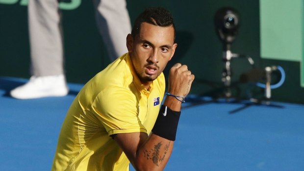 Irresistible form: Nick Kyrgios reacts to winning a crucial point against John Isner.