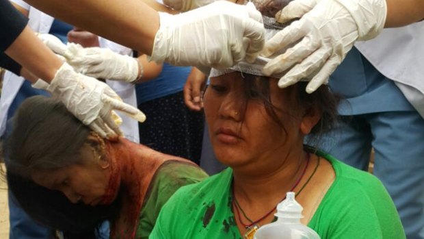 Injured people receive treatment in Kathmandu.