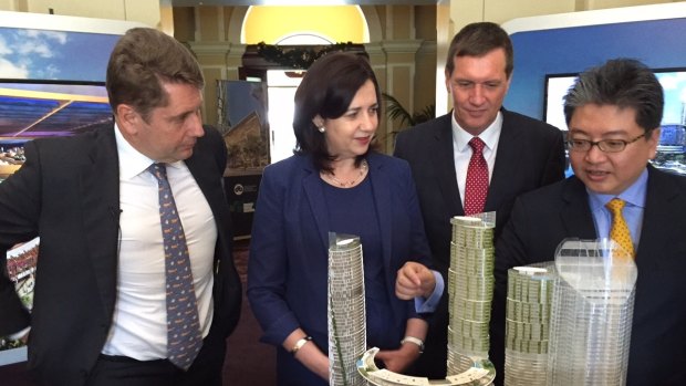 Star Entertainment CEO Matt Bekier shows Queensland Premier Annastacia Palaszczuk, State Development Minister Anthony Lynham and Far Eastern Consortium director Chris Hoong features of the Queens Wharf Brisbane model.