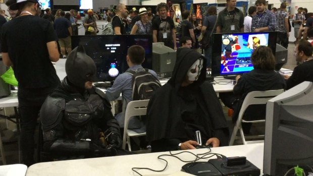 Batman takes a break from his busy schedule to get reacquainted with the Sega Mega Drive II game console at PAX.