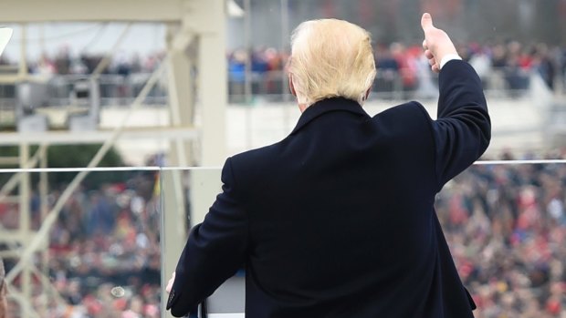 President Donald Trump acknowledges the crowd during the presidential inauguration on Capitol Hill.