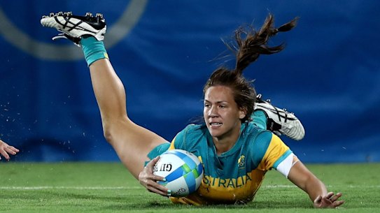 Evania Pelite goes over for a try.