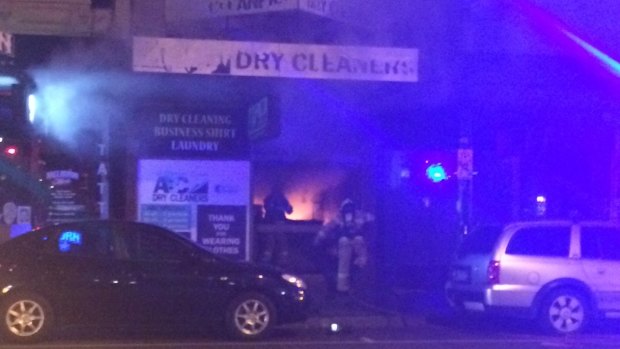 A dry cleaners engulfed in flames on Chapel Street on Friday night. 