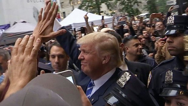 Donald Trump leaves Trump Tower on Saturday, insisting he "would never" abandon his White House bid.