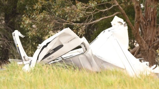 A woman died after a car crashed while being chased by police near on the Western Freeway.