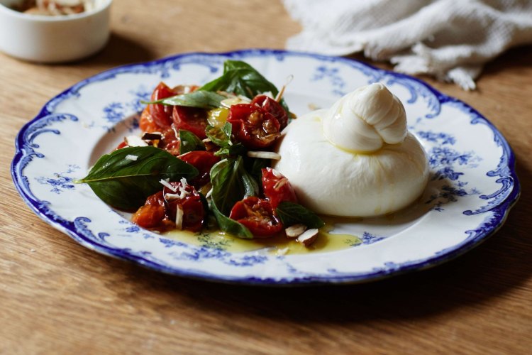 Julia Busuttil Nishimura's burrata with roasted cherry tomato and basil.