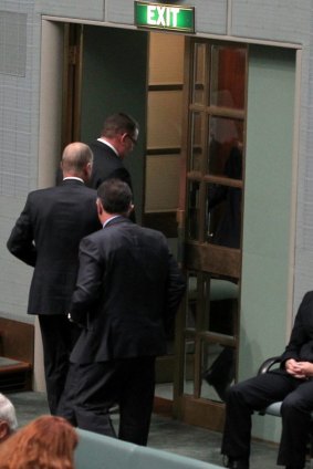 Short fuse: A group of Coalition MPs walk out of the chamber while Opposition Leader Bill Shorten delivers a Closing the Gap statement.