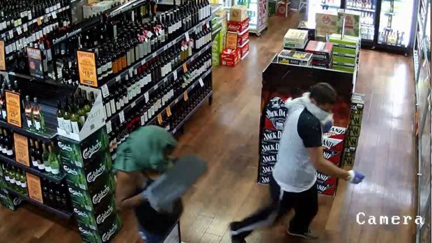 Police are searching for three people after an aggravated robbery at a Gold Creek bottle shop.