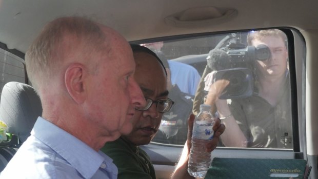 Peter Dundas Walbran in police custody in Ubon Ratchathani on Wednesday.
