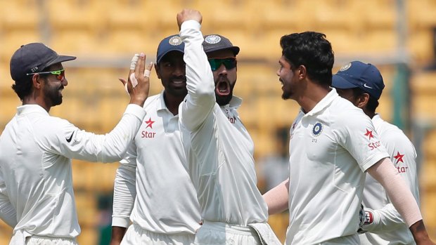No love lost: India captain Virat Kohli celebrates after the dismissal of Steve Smith.