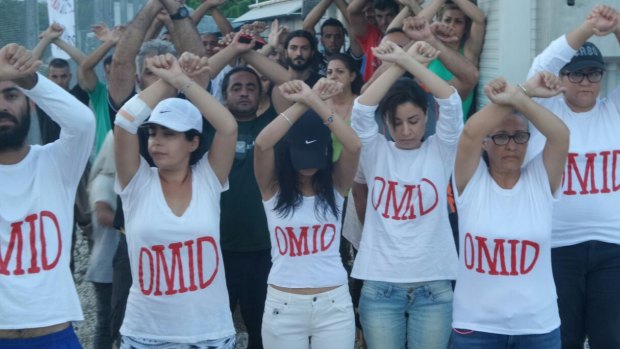 Refugees on Nauru wear T-shirts with Omid's name as a show of solidarity.