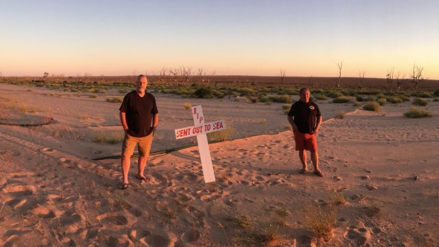 Darryn Clifton (left) and  Ross Leddra photographed on the dry shore of Lake Menindee, last October.