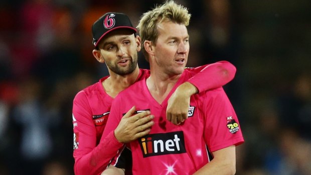 Fine career: Brett Lee, right, celebrates with Nathan Lyon after he claims a wicket.