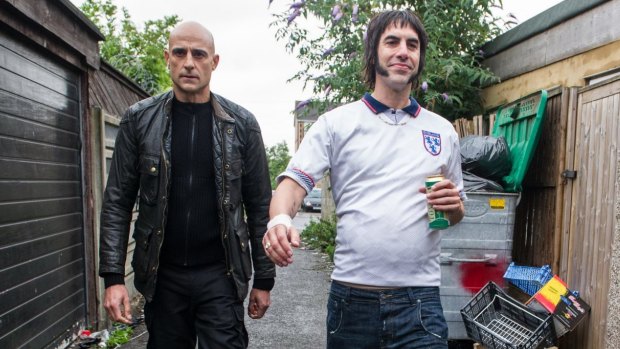 Mark Strong (left) as Agent Sebastian Butcher and Sacha Baron Cohen as Carl ''Nobby'' Butcher in <i>Grimsby</i>.