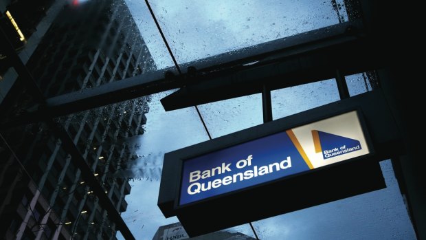 Bank of Queensland said strong competition and the low interest rate environment were to blame for lower earnings in the first half.