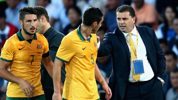 Sideline chat:  Ange Postecoglou speaks with Mark Milligan during match between Kyrgyzstan and the Socceroos.