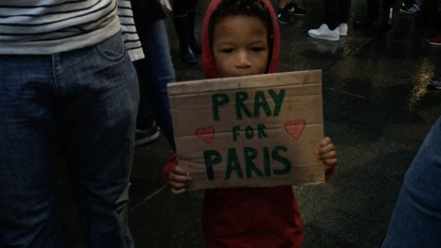 Three-year-old Gabriel holds a sign at Sydney's Martin Place vigil.