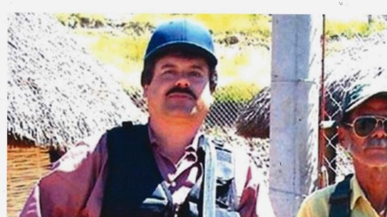 Joaquin "El Chapo" Guzman, left, poses with an unidentified man. 