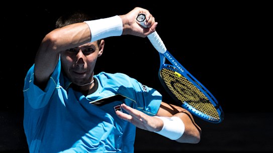 Alexei Popyrin spanks a forehand in his first round win over Marc Polmans.