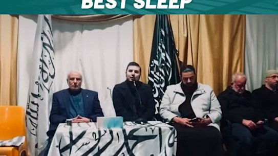 The Grand Mufti of Australia Dr Ibrahim Abu Mohamad left, sitting next to Wassim Doureihi and Bilal Mehi, from Hizb ut-Tahrir, in the 2023 anniversary. 