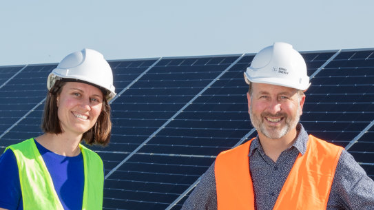 Solar garden pioneers Kristy Walters and Jonathan Prendergast inspect the Grong Grong site as the last panel are installed.