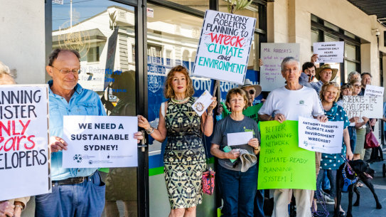 Protesters outside the electorate office of Planning Minister Anthony Roberts.