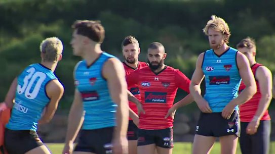 Essendon defenders Conor McKenna (L) and Adam Saad during a Bombers training session at NEC Hangar in Melbourne, Friday, June 19, 2020.