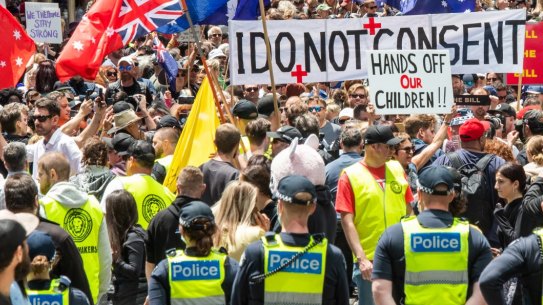 Police look on as protesters gather in Melbourne's CBD.