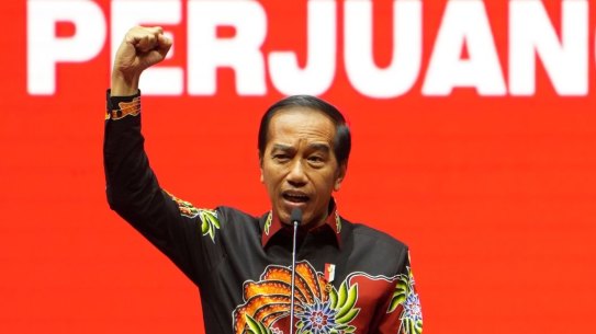 Indonesian President Joko Widodo, speaks during the Democratic Party of Struggle’s (PDI-P) 50th-year anniversary event in Jakarta, on Tuesday.  Behind him the word “struggle”.