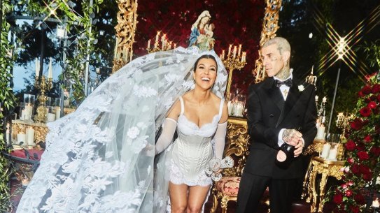 Kourtney Kardashian and Travis Barker wearing Dolce & Gabbana at their Italian wedding.