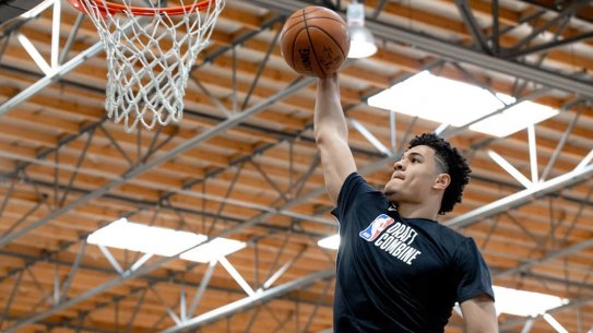 Australian NBA Draft hopeful Josh Green dunks while training at IMPACT Basketball in Las Vegas.