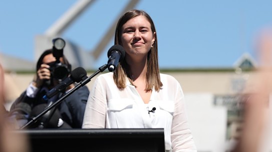 Brittany Higgins addressing thousands of people outside Parliament House.