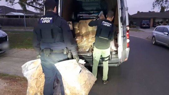 Viper officers loading tobacco bales seized in Delahey as past of a series of coordinated raids across the state in July