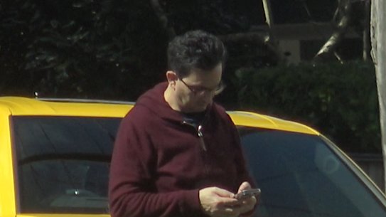 “I enjoy cars, but I work very hard for what I do.” Al Muderis with his wife’s Lamborghini SUV.