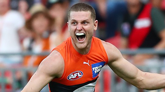 Jacob Hopper celebrates kicking a late goal for the Giants.