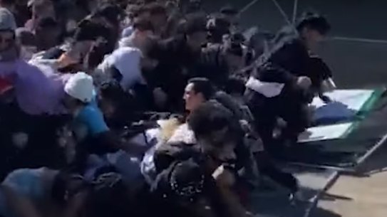 A still from US television showing thhe crowd rush. 