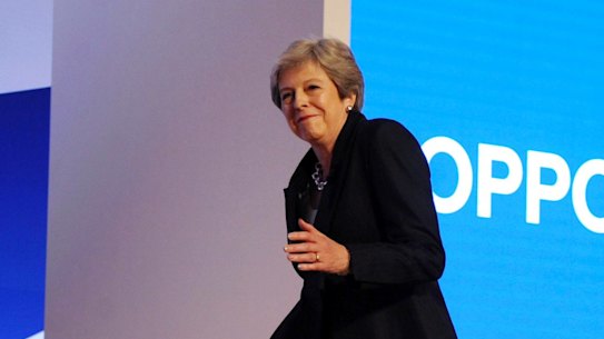 Theresa May dances as she arrives on stage at the Conservative Party conference in October.
