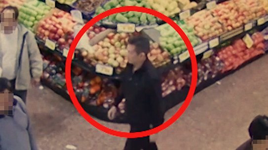 Roy Moo on surveillance footage about to pick up a bag of money from another man for laundering through Crown casino in Melbourne.