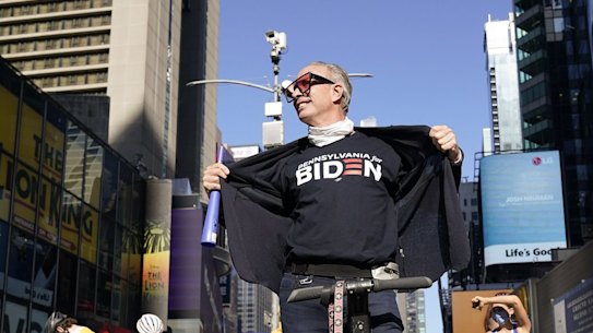 People celebrate Joe Biden's victory in Times Square, New York.