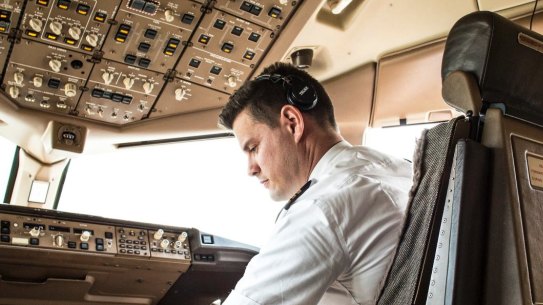 A pilot at the controls.